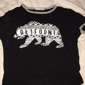 Papaya black slightly cropped shirt.